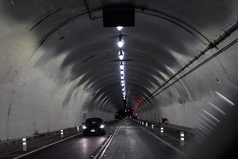 A Lyft rideshare driver passes through the Second Street Tunnel, ahead of Super Bowl LVI, under Bunker Hill in downtown Los Angeles, California, U.S., January 29, 2022.  REUTERS/Bing Guan