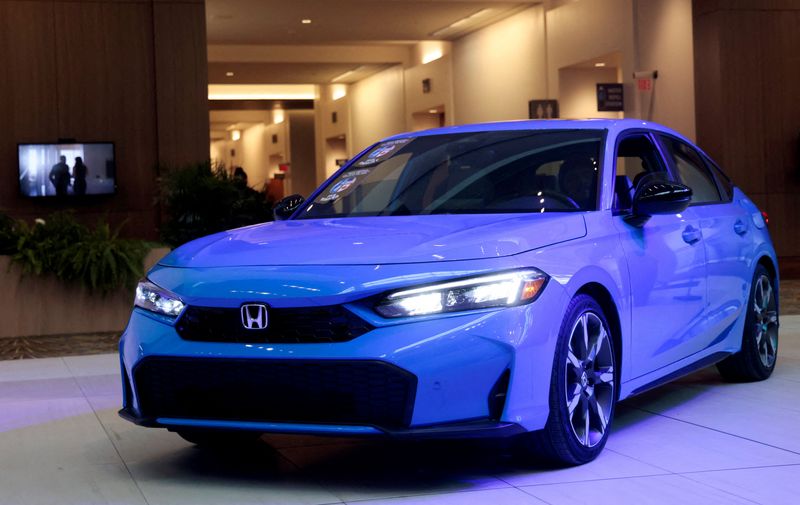 FILE PHOTO: A Honda Civic hybrid is seen on display after winning the 2025 North American Car of the year award during media day at the 2025 Detroit Auto Show at Huntington Place in Detroit, Michigan, U.S. January 10, 2025.    REUTERS/Rebecca Cook/File Photo