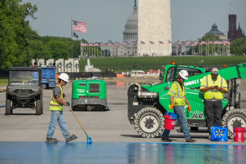 Workers continue renovations on the Lincoln Memorial Reflecting Pool, which is painted blue, in Washington, D.C., U.S., May 2, 2026. REUTERS/Ken Cedeno
