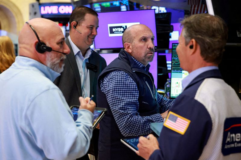 FILE PHOTO: Traders work on the floor at the New York Stock Exchange (NYSE) in New York City, U.S., May 5, 2026.  REUTERS/Brendan McDermid/File Photo