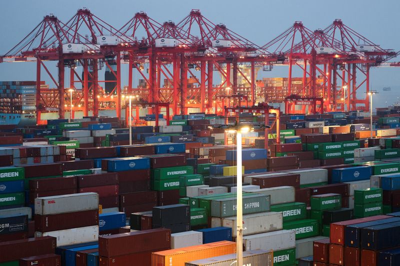 Gantry cranes stand near stacked shipping containers at Yangshan Port outside Shanghai, China, May 7, 2026.  REUTERS/Go Nakamura