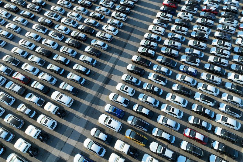 FILE PHOTO: New cars are parked in rows after arriving by ship at Annacis Island in Delta, British Columbia, Canada, July 31, 2023. REUTERS/Chris Helgren/File Photo