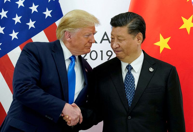 FILE PHOTO: U.S. President Donald Trump meets with China's President Xi Jinping at the start of their bilateral meeting at the G20 leaders summit in Osaka, Japan, June 29, 2019. REUTERS/Kevin Lamarque/File Photo