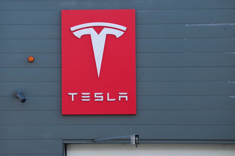A Tesla logo is pictured at a Tesla dealership, after Tesla, Inc. released its financial results for the first quarter of 2025, in Berlin, Germany April 23, 2025. REUTERS/Annegret Hilse