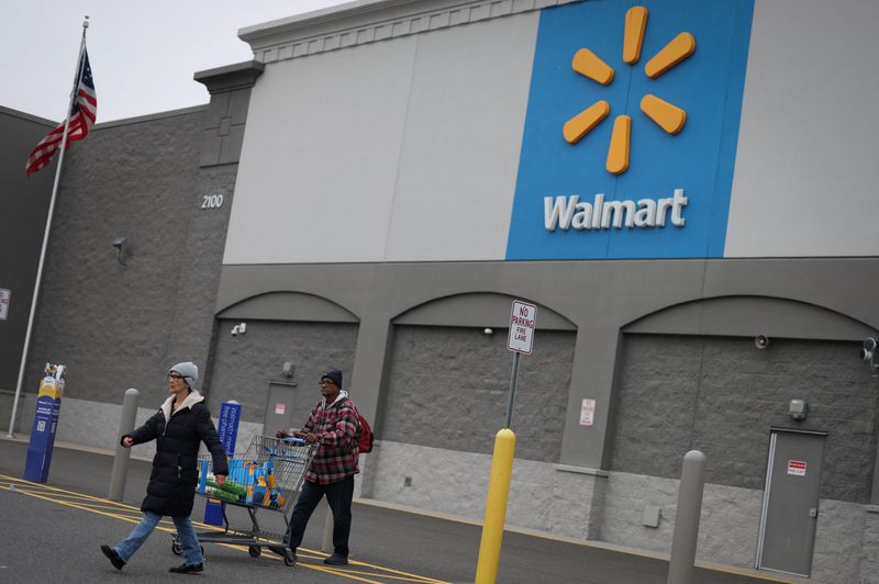 Customers leave a Walmart Supercenter retail store in North Bergen, New Jersey, U.S., November 21, 2025.  REUTERS/Mike Segar