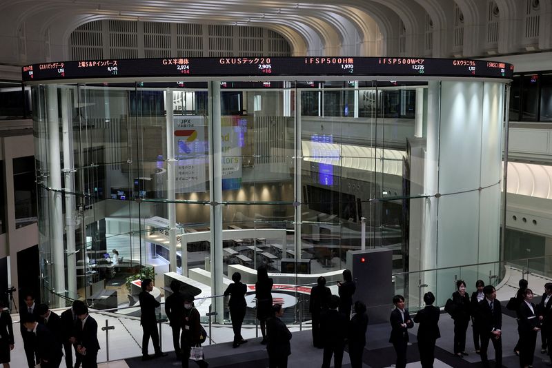 FILE PHOTO: Visitors walk inside Japan Exchange Group's Tokyo Stock Exchange in Tokyo, Japan, April 6, 2026. REUTERS/Issei Kato/File Photo