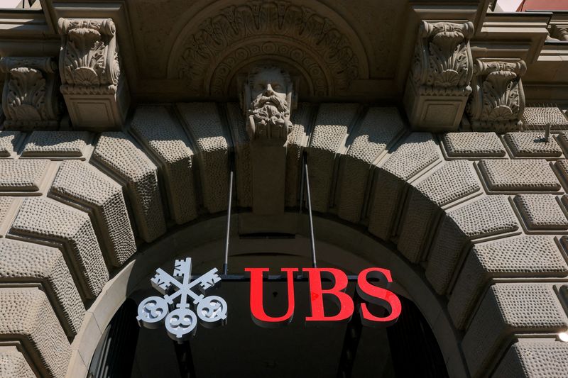 FILE PHOTO: A logo of Swiss bank UBS on a building at the Paradeplatz in Zurich, Switzerland, March 19, 2026. REUTERS/Denis Balibouse/File Photo