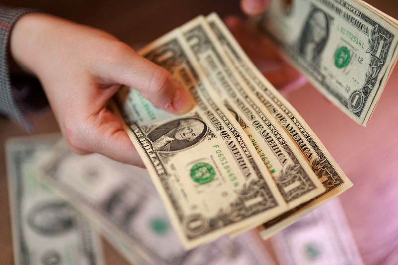 U.S. dollar banknotes are seen in this illustration taken March 24, 2026. REUTERS/Dado Ruvic/Illustration