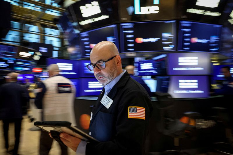 FILE PHOTO: Traders work on the floor at the New York Stock Exchange (NYSE) in New York City, U.S., May 7, 2026.  REUTERS/Brendan McDermid/File Photo