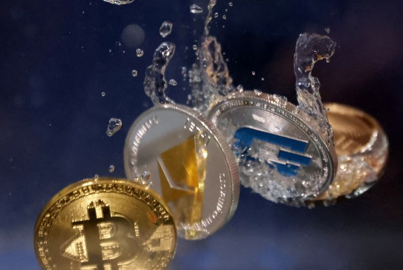 Representations of cryptocurrency Bitcoin, Ethereum and Dash plunge into water in this illustration taken, May 23, 2022. REUTERS/Dado Ruvic/Illustration