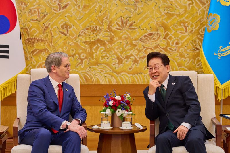 South Korean President  Lee Jae Myung talks with U.S. Treasury Secretary Scott Bessent during their meeting at the Presidential Blue House in Seoul, South Korea, May 13, 2026.    The Presidential Blue House/Yonhap via REUTERS   THIS IMAGE HAS BEEN SUPPLIED BY A THIRD PARTY. NO RESALES. NO ARCHIVES. SOUTH KOREA OUT. NO COMMERCIAL OR EDITORIAL SALES IN SOUTH KOREA.