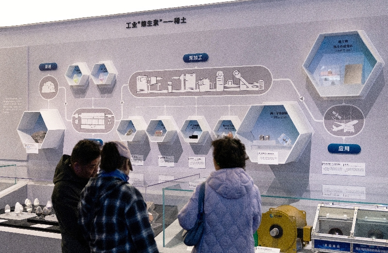 People gather at the rare earth elements production section of the exhibition on China’s manufacturing achievements at the National Museum in Beijing, China, March 24, 2026. REUTERS/Maxim Shemetov