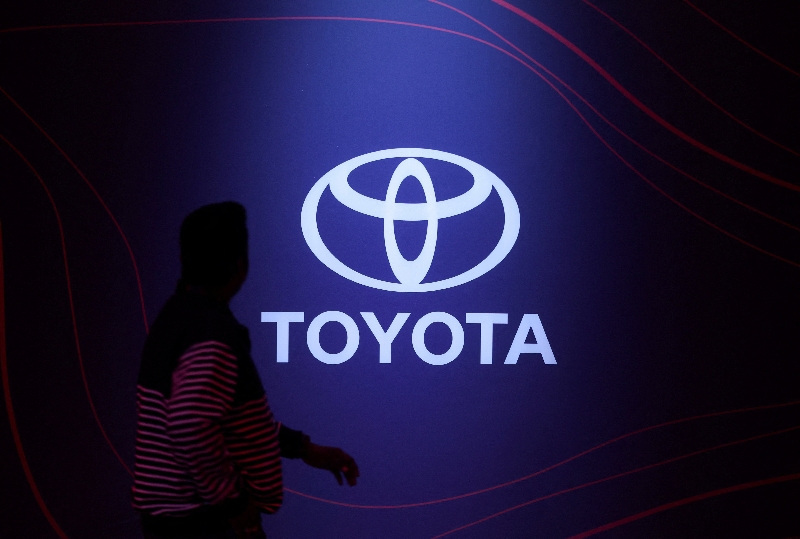 A man walks past the Toyota logo during a launch event in Mumbai, India, January 20, 2026. REUTERS/Francis Mascarenhas
