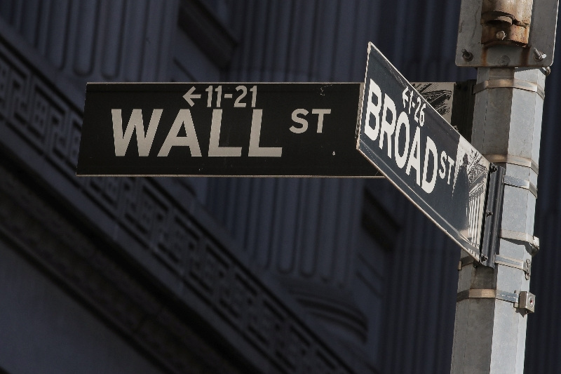 Street signs for Broad St. and Wall St. are seen outside of the New York Stock Exchange (NYSE) in New York, U.S., March 7, 2019. REUTERS/Brendan McDermid