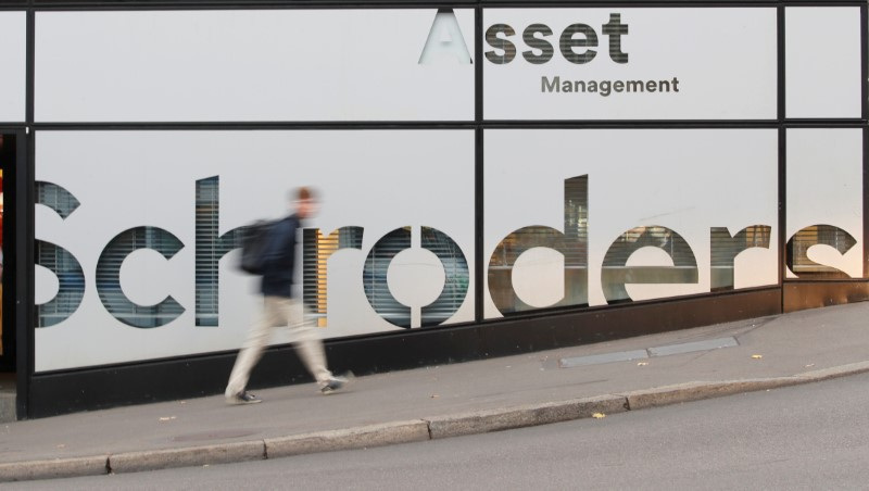 A man walks past the logo of investment management company Schroders at a branch in Zurich, Swtzerland November 5, 2018.   REUTERS/Arnd Wiegmann