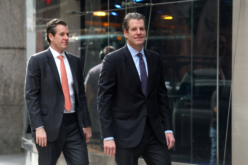 FILE PHOTO: Tyler Winklevoss and Cameron Winklevoss, attend the opening bell ceremony for American Bitcoin at the Nasdaq Market in New York City, U.S., September 16, 2025.  REUTERS/Brendan McDermid/File Photo