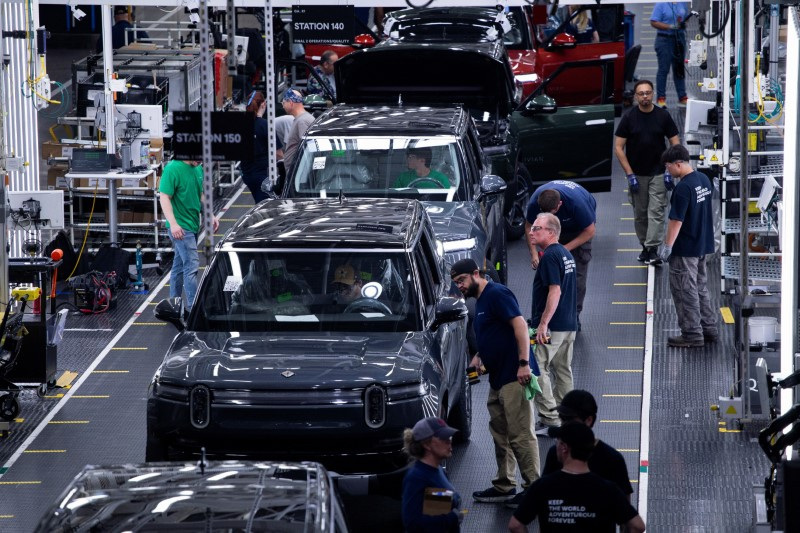 Workers assemble second-generation R1 vehicles at electric auto maker Rivian's manufacturing facility in Normal, Illinois, U.S. June 21, 2024.  REUTERS/Joel Angel Juarez