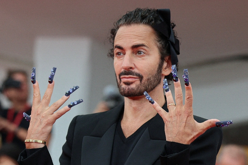 FILE PHOTO: U.S. designer Marc Jacobs poses on the red carpet for the screening of the movie "Marc by Sofia" out of competition, at the 82nd Venice Film Festival, in Venice, Italy, September 2, 2025. REUTERS/Yara Nardi/File Photo