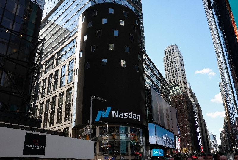 The Nasdaq logo is displayed on a screen at the Nasdaq Market site in Times Square in New York City, U.S., April 17, 2026. REUTERS/Brendan McDermid