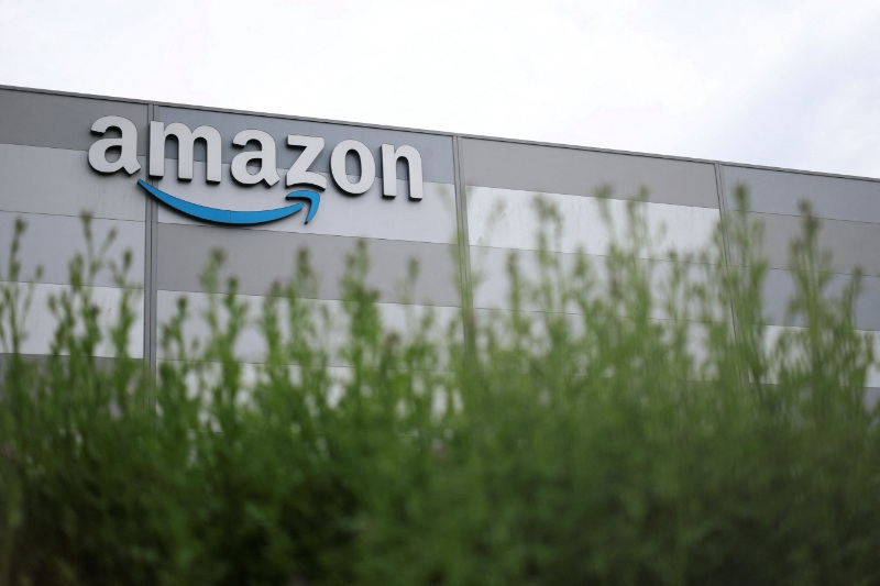 The logo of Amazon is pictured at a company logistics center in Carquefou near Nantes, westren France, May 6, 2026. REUTERS/Stephane Mahe