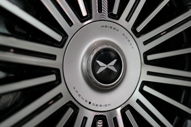 The XPeng logo is displayed on a tire of an XPeng GX SUV, on display at an XPeng dealership, in Beijing, China, April 23, 2026. REUTERS/Tingshu Wang
