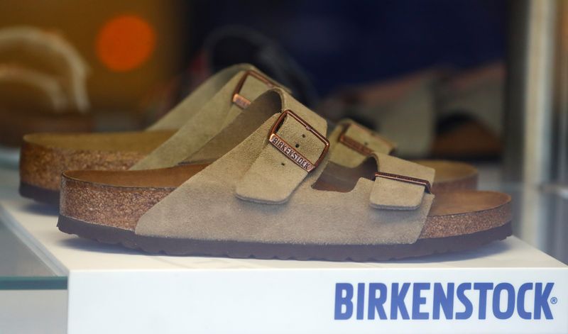 A pair of shoes is pictured in a window of a Birkenstock footwear store in Berlin, Germany, January 21, 2021.  REUTERS/Fabrizio Bensch/File Photo