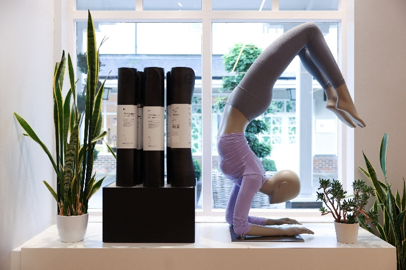 Yoga products displayed at a Lululemon outlet retail store at Bicester Village in Oxfordshire, Britain, August 21, 2024. REUTERS/Hollie Adams/File Photo