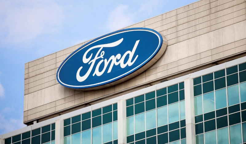 FILE PHOTO: A Ford logo is seen on the Ford Motor World headquarters in Dearborn, Michigan, U.S., March 12, 2025. REUTERS/Rebecca Cook/File Photo
