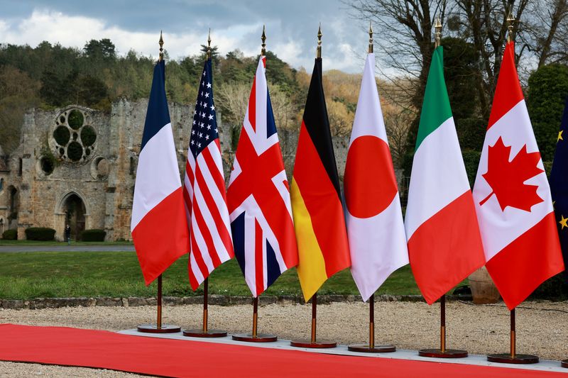 The flags of France, U.S., Britain, Germany, Japan, Italy and Canada on the day of the G7 Foreign Ministers' Meeting at Vaux-de-Cernay Abbey in Cernay-la-Ville near Paris, France, March 26, 2026. REUTERS/Stephanie Lecocq