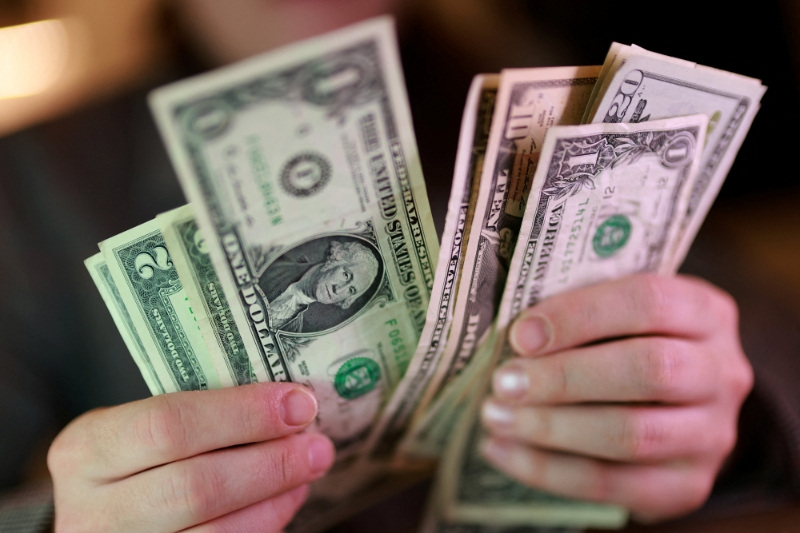 U.S. dollar banknotes are seen in this illustration taken March 24, 2026. REUTERS/Dado Ruvic/Illustration