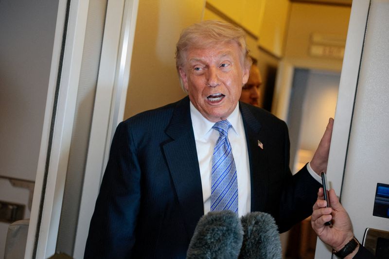 FILE PHOTO: U.S. President Donald Trump speaks to the press aboard Air Force One in China, May 15, 2026. REUTERS/Evan Vucci/File Photo