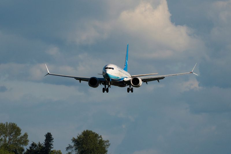 A Boeing 737 MAX 8, the second jet intended for use by a Chinese airline to be returned to its manufacturer, lands at Boeing Field, as trade tensions escalate over U.S. tariffs with China, in Seattle, Washington, U.S. April 22, 2025. REUTERS/David Ryder
