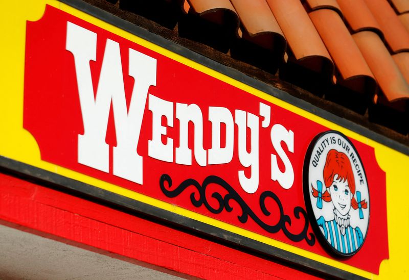 FILE PHOTO: A Wendy's sign and logo are shown at one of the company's restaurant in Encinitas, California May 10, 2016 .  REUTERS/Mike Blake/File Photo