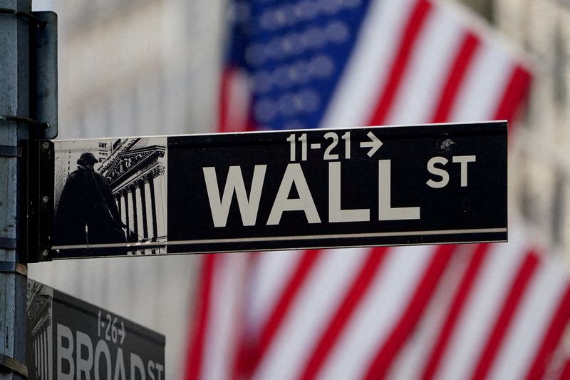 FILE PHOTO: The Wall Street sign is pictured at the New York Stock Exchange in the Manhattan borough of New York City, New York, U.S., March 9, 2020. REUTERS/Carlo Allegri/File Photo