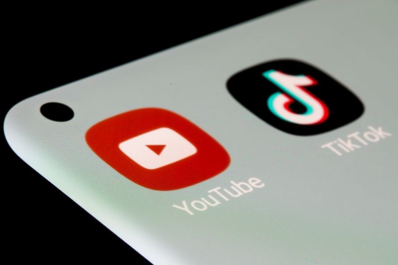 YouTube and TikTok apps are seen on a smartphone in this illustration taken, July 13, 2021. REUTERS/Dado Ruvic/Illustration
