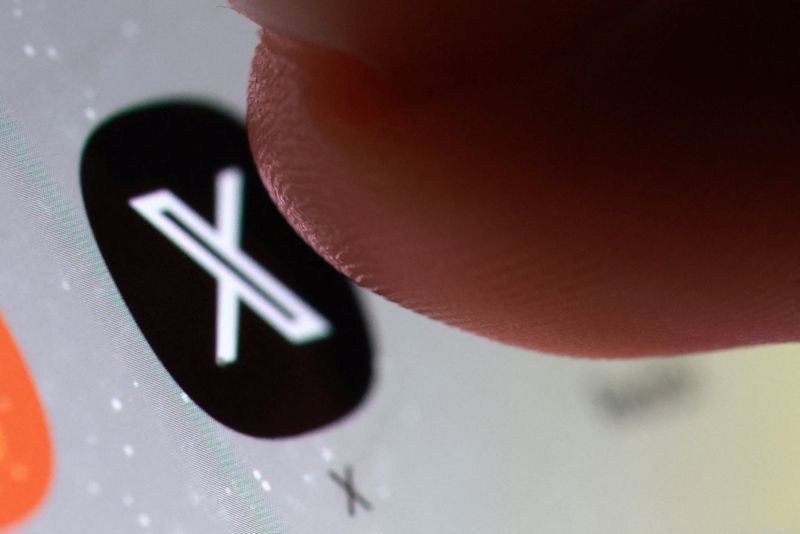 The X app icon on a smartphone in this illustration taken October 27, 2025. REUTERS/Dado Ruvic/Illustration