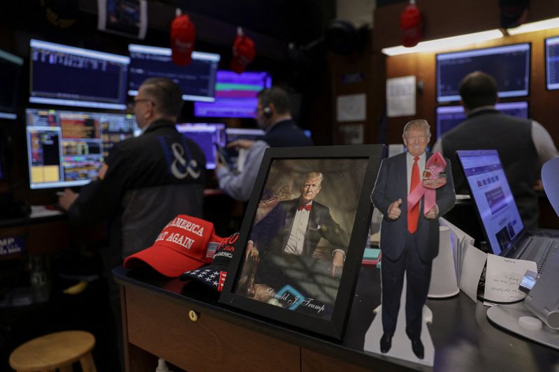 An image of U.S. President Donald Trump as traders work on the floor at the New York Stock Exchange (NYSE) in New York City, U.S., May 15, 2026. REUTERS/Jeenah Moon
