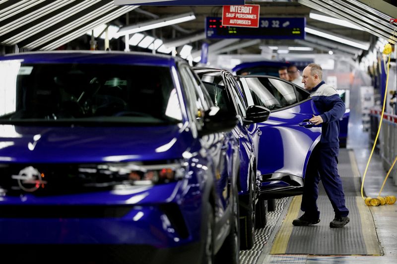 FILE PHOTO: A worker inspects a Opel Mokka sport utility vehicle (SUV) on the production line at the Stellantis automobile plant in Poissy, near Paris, France, May 4, 2026. REUTERS/Benoit Tessier/File Photo