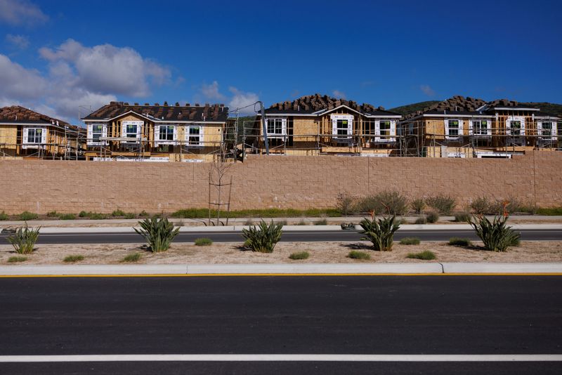 Scaffoldings are set up around single-family residential homes under construction in San Marcos, California, U.S., March 25, 2024.  REUTERS/Mike Blake