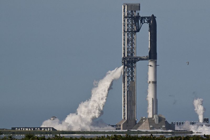 The SpaceX Starship spacecraft sits atop the Super Heavy Booster, ahead of the 12th test flight of the Starship spacecraft in Starbase, Texas, U.S., May 21, 2026. REUTERS/Steve Nesius