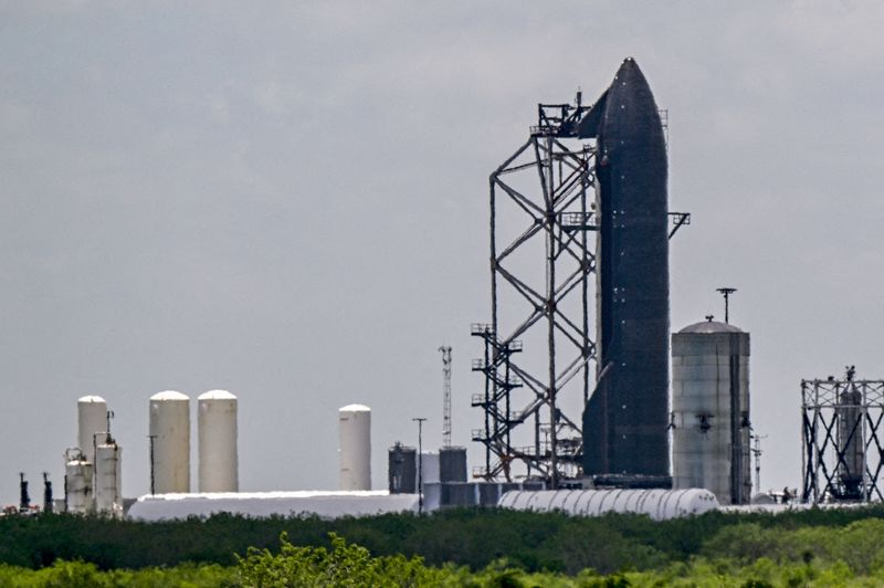 FILE PHOTO: Starship 39 stands at the Massey Test Site, the SpaceX rocket testing facility, as preparations continue for the 12th test flight of the Starship spacecraft and the Super Heavy booster in Starbase, Texas, U.S., May 15, 2026. REUTERS/Steve Nesius/File Photo