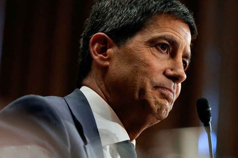 FILE PHOTO: Kevin Warsh, U.S. President Donald Trump's nominee to be next chair of the Federal Reserve, attends a Senate Banking Committee confirmation hearing to testify, on Capitol Hill in Washington, D.C., U.S., April 21, 2026. REUTERS/Elizabeth Frantz/File Photo