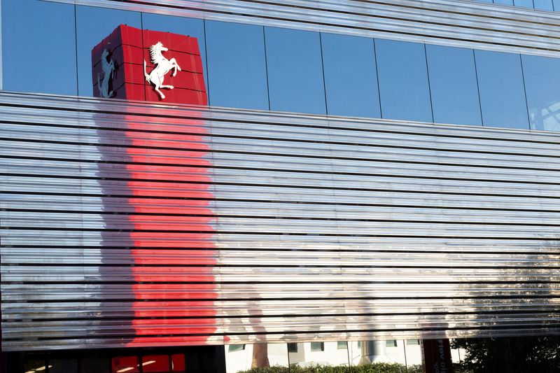 FILE PHOTO: A Ferrari logo is reflected on the external wall of the company's factory in Maranello, Italy, October 2, 2025. REUTERS/Remo Casilli/File Photo