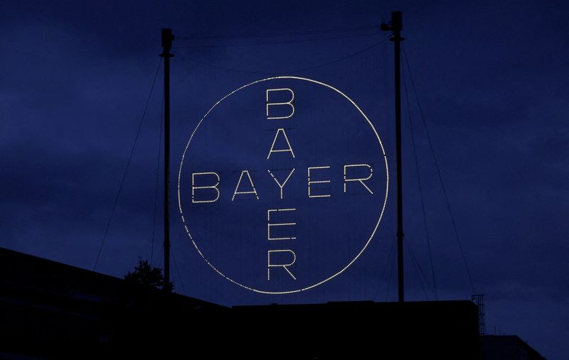 FILE PHOTO: The 120 metres high Bayer Cross, logo of German pharmaceutical and chemical maker Bayer AG, consisting of 1710 LED glass bulbs is seen outside the industrial park "Chempark" of the chemical industry in Leverkusen, Germany, September 23, 2023. REUTERS/Wolfgang Rattay/File Photo