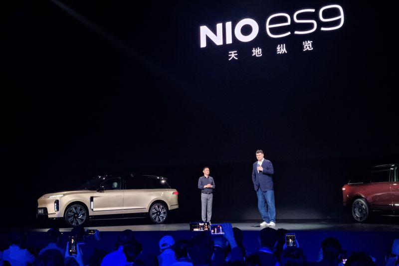 NIO CEO William Li and former basketball player Yao Ming, who was selected to represent NIO's new flagship electric SUV, the ES9, attend a launch event for the car in Beijing, China May 27, 2026. REUTERS/Ju-min Park