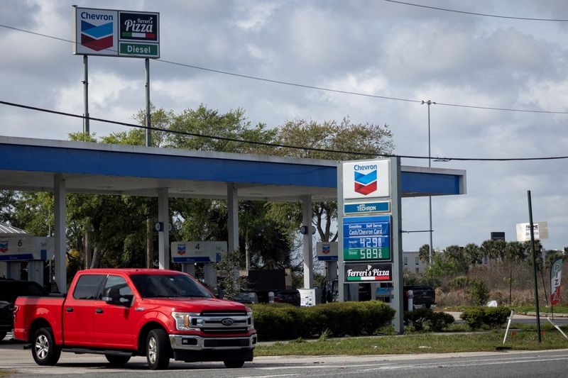 FILE PHOTO: Gas prices are displayed at a gas station as the prices of oil and gas surge, amid the U.S.-Israel conflict with Iran, in Titusville, Florida, U.S., March 31, 2026. REUTERS/Marco Bello/File Photo