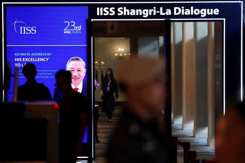 People walk at the venue of the IISS Shangri-la Dialogue security summit in Singapore May 29, 2026. REUTERS/Edgar Su