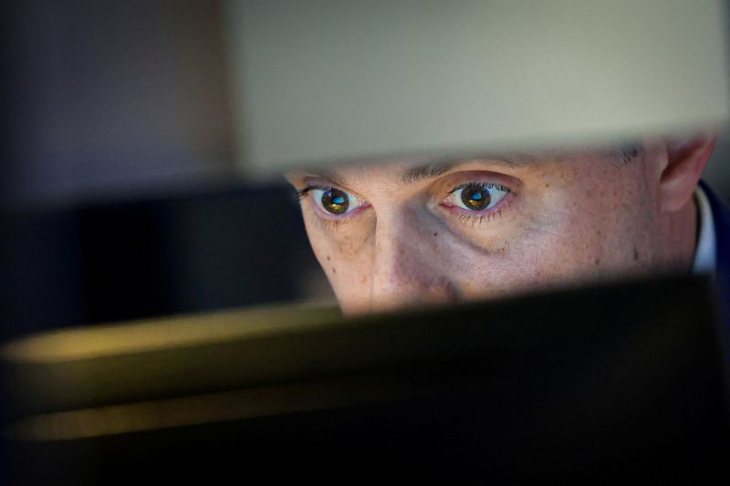 FILE PHOTO: A specialist trader works at his post on the floor at the New York Stock Exchange (NYSE) in New York City, U.S., May 7, 2026.  REUTERS/Brendan McDermid/File Photo