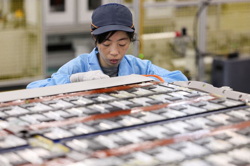 An employee works on a battery assembly line at the factory of Leapenergy, a unit of Leapmotor, during an organised media tour in Huzhou, Zhejiang province, China, April 26, 2026.  REUTERS/Go Nakamura