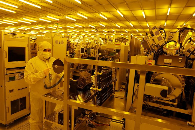 FILE PHOTO: Staff work in the clean room of the facility, following the announcement of a 115 million pound investment in Next-Gen hard drive development at the Seagate plant in Londonderry, Northern Ireland, September 11, 2025. REUTERS/Cathal McNaughton/File Photo